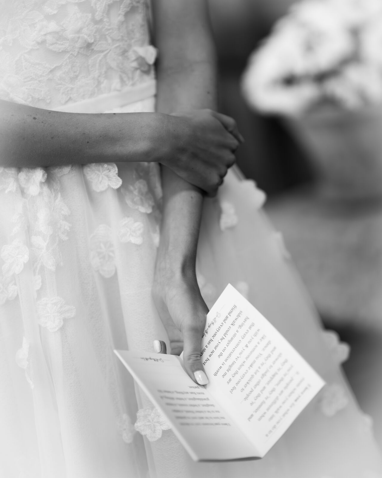 Handwritten vow book held during the ceremony